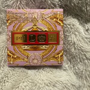 Pat McGrath Labs Highlighter in Gold and Purple Packaging